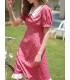 Abito a pois rosso rosa con risvolto francese