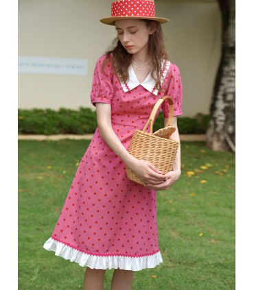 Abito a pois rosso rosa con risvolto francese