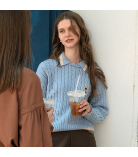 Maglione in lana intrecciata con ricamo margherita 