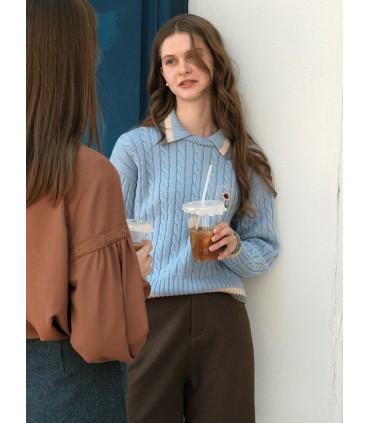 Pull en laine torsadée brodé marguerite 